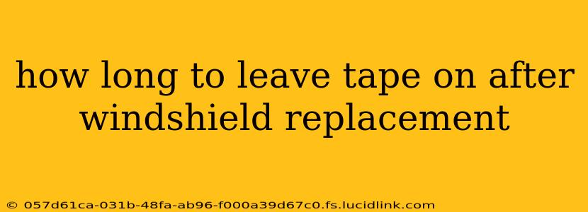 how long to leave tape on after windshield replacement